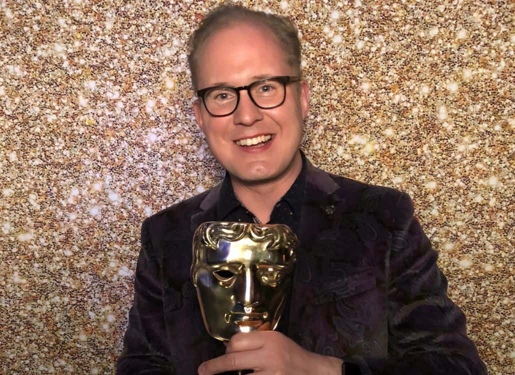 Voice actor Marc Silk with his award